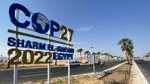 Photo of COP 27 sign on a road to Sharm el sheik