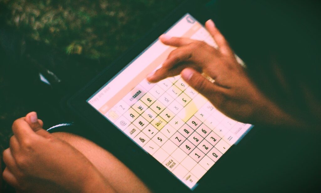 person operating a tablet device